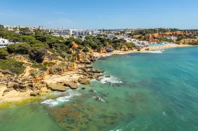 an aerial view of a beach with blue water at Bosque São José by Algarneto in Albufeira
