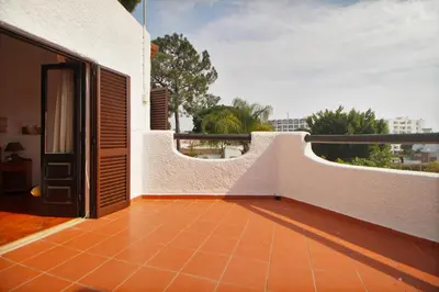 a laundry room with a washing machine and white cabinets at Villa 3 Quartos, Piscina, BBQ, Jardim, Prestige For Home in Vilamoura
