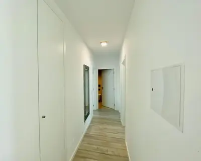 a hallway of a house with white walls and wooden floors at Albuhera - Private Pool - 8 Pax - Albufeira in Albufeira