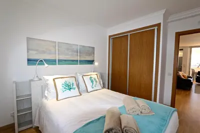 a bedroom with a bed with towels on it at Marina Plaza 162 - Clever Details in Vilamoura