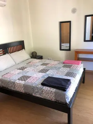 a bedroom with a bed with a quilt on it at Rockfield 4 in Albufeira