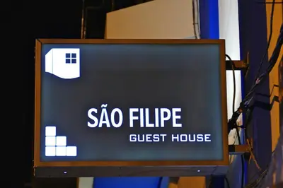 a sign for a sigma fibre guest house at Guest House Sao Filipe in Faro