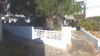 a kitchen with a microwave on top of a counter at Charming Apartment in Quarteira - 50 sqm - Balcony with View in Quarteira