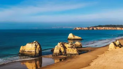 a view of a rocky shoreline with the ocean at Charming Apartment in Quarteira - 50 sqm - Balcony with View in Quarteira
