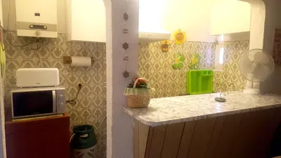 a crib with two towels on top of it at Charming Apartment in Quarteira - 50 sqm - Balcony with View in Quarteira
