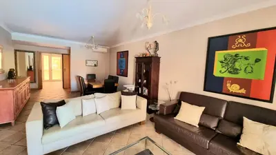 a living room with two couches and a table at Citadela I, Golfe, Pool and Falesia Beach in Vilamoura
