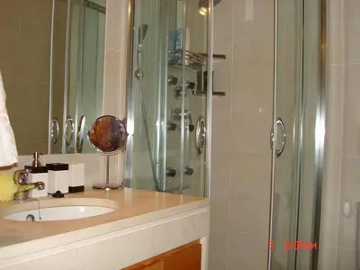a bathroom with a sink and a shower at Citadela I, Golfe, Pool and Falesia Beach in Vilamoura