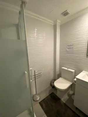 a small bathroom with a toilet and a sink at Amora Villa - Vilamoura in Vilamoura