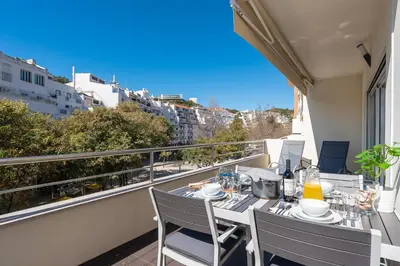 a balcony with a table and chairs on a balcony at VERASOL 3 in Albufeira