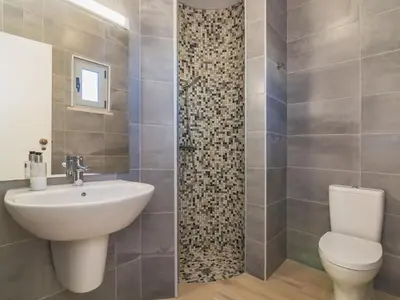a bathroom with a sink and a toilet at Villa Arribas Villa by Interhome in Patroves