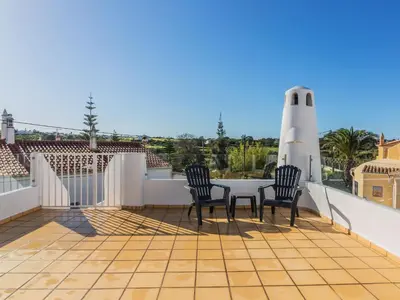 a patio with two chairs and a table on a balcony at Villa Arribas Villa by Interhome in Patroves
