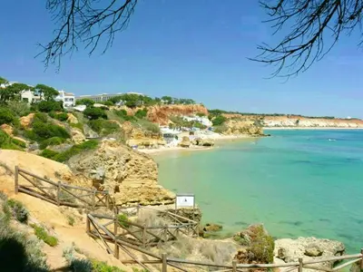 a view of a beach with the ocean and houses at Welcoming apartment in Albufeira 80 m² with shared pool in Albufeira
