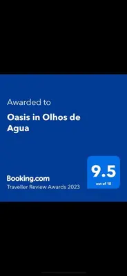 a room with a glass door in a building at Oasis in Olhos de Agua in Branqueira
