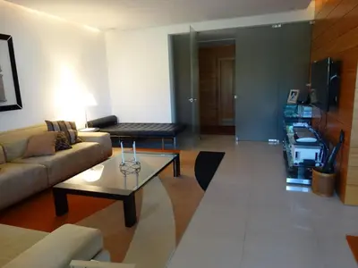a living room with a couch and a coffee table at Apartamento com 3 quartos e piscina in Vale do Lobo
