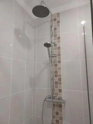 a shower with a shower head in a bathroom at Sea View 3 in Albufeira