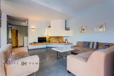 a living room with two couches and a tv at Villa Oriente - Greice Homes in Vilamoura