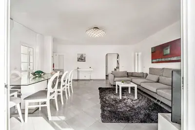 a living room with a couch and a table at Villa Jomar in Guia