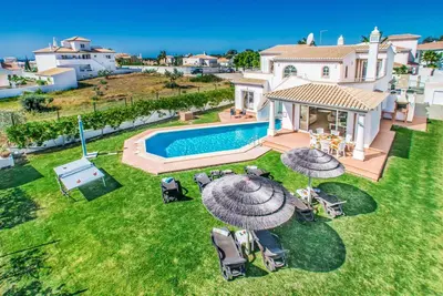 an aerial view of a house with a swimming pool at Villa Damara in Albufeira