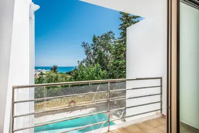 a balcony with a view of the ocean at Villa Sao Joao in Caliços