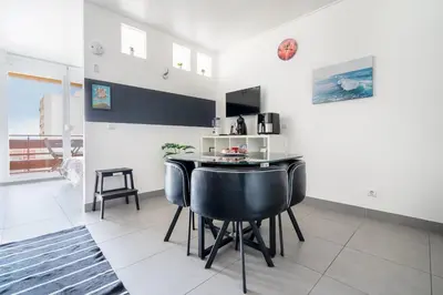 a living room with a tv and a table at SUITEON7TH VILAMOURA THE BEST VIEW IN TOWN - 1Br in Quarteira
