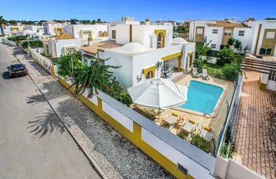 an aerial view of a house with a swimming pool at Villa Arines in Albufeira