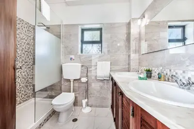 a bathroom with a toilet and a sink at Villa Severino in Albufeira