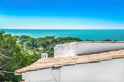 a view of the ocean from the roof of a house at Villa Miramar in Albufeira