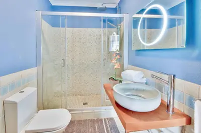 a bathroom with a shower and a toilet and a sink at Villa Monte de Madrinha in Albufeira