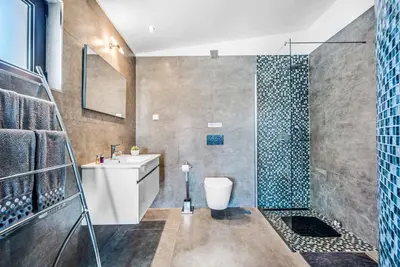 a bathroom with a shower and a toilet and a sink at Casa dos Amigos in Albufeira