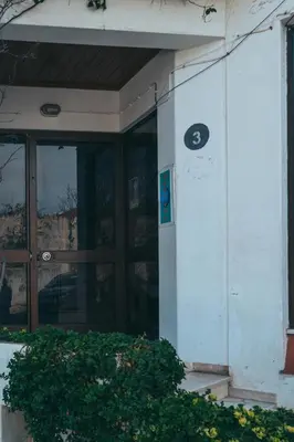a building with a door with a sign on it at Apartamentos Old Town by Umbral in Albufeira