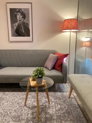 a living room with a couch and a table at CASA JOY Vilamoura apartment in Vilamoura