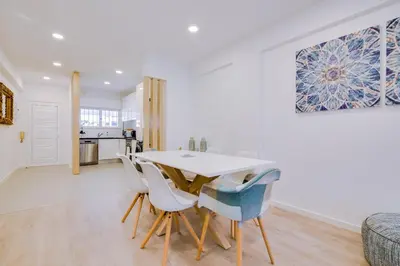 a kitchen and dining room with a table and chairs at Ella - Fantastic apartment - Vilamoura in Vilamoura