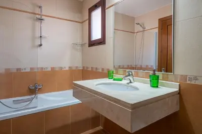 a bathroom with a sink and a bath tub at Vilasol apartment by Intiholidays in Vilamoura