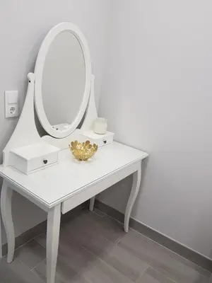a white dressing table with a mirror on it at Vilamoura Apartment in Quarteira