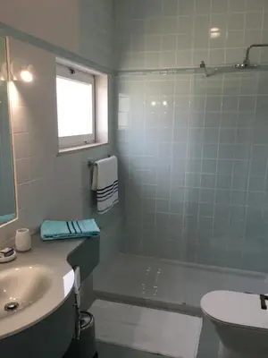 a bathroom with a sink and a toilet and a shower at Chambre d Hôte exclusif Naturiste et Nudiste CASA AMSYL adultes only in Paderne