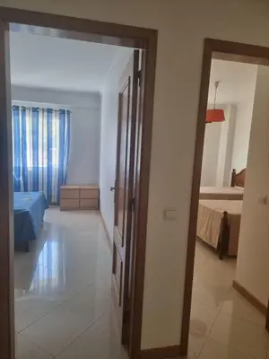 a room with a door leading to a bedroom at Albufeira Apart. T2 Baixa in Albufeira