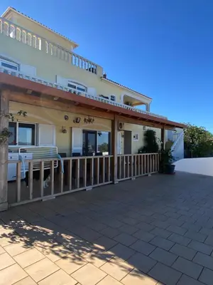 a large house with a large deck at casa da ainheira 44 cruz da assumada 8100-296 Loulé in Loulé