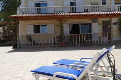 two lawn chairs and two chairs on a patio at casa da ainheira 44 cruz da assumada 8100-296 Loulé in Loulé