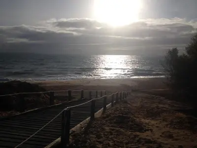 a path to the beach with the sun in the sky at Guesthouse RSA by Umbral in Almancil