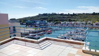 a view of a marina with boats in the water at Albufeira Marina Penthouse 1 in Albufeira