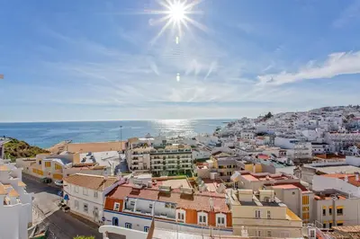 a view of a city with the ocean in the background at AZUL/MAR ALBUFEIRA 602 in Albufeira