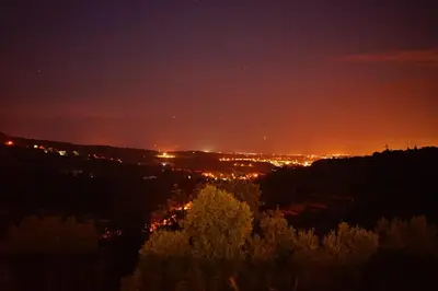 a view of a city lit up at night at Luxury Casa da Fonte - Private Heated Salt Pool in Faro