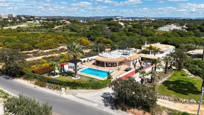 an aerial view of a house with a swimming pool at Villa Dolce Vita in Albufeira