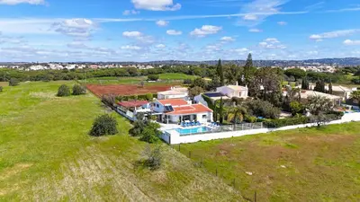 an aerial view of a house in a field at Villa Maria in Albufeira