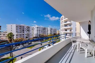 a balcony with a view of a city at Rei - Quarteira - 3 min to the beach in Vilamoura