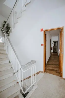 a staircase in a home with a white stair case at DREAMS HOUSE in Faro