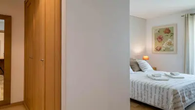 a bedroom with a bed with a white bedspread at Marina Vilamoura - Aquamar 120 - By Vilamoura Sun in Vilamoura