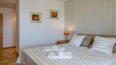 a bedroom with a bed with towels on it at Marina Vilamoura - Aquamar 120 - By Vilamoura Sun in Vilamoura