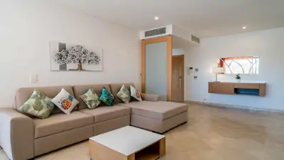 a living room with a couch and a table at Marina Vilamoura - Aquamar 120 - By Vilamoura Sun in Vilamoura