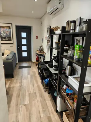 a living room with shelves and a door at The Old Town House by Freetimealgarve in Faro
